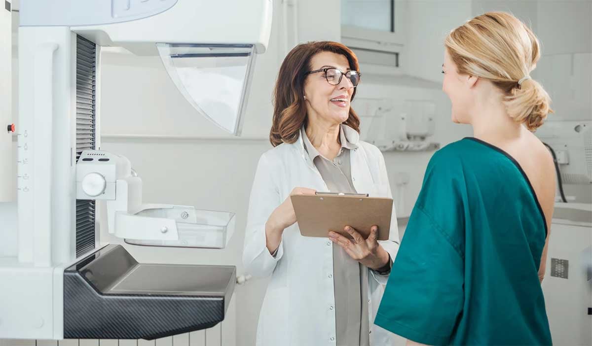 a doctor chats with her breast cancer patient after she had a mammogram