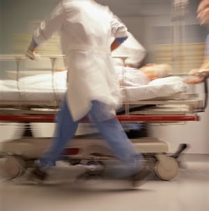 Patient being rushed to the emergency room on a gurney