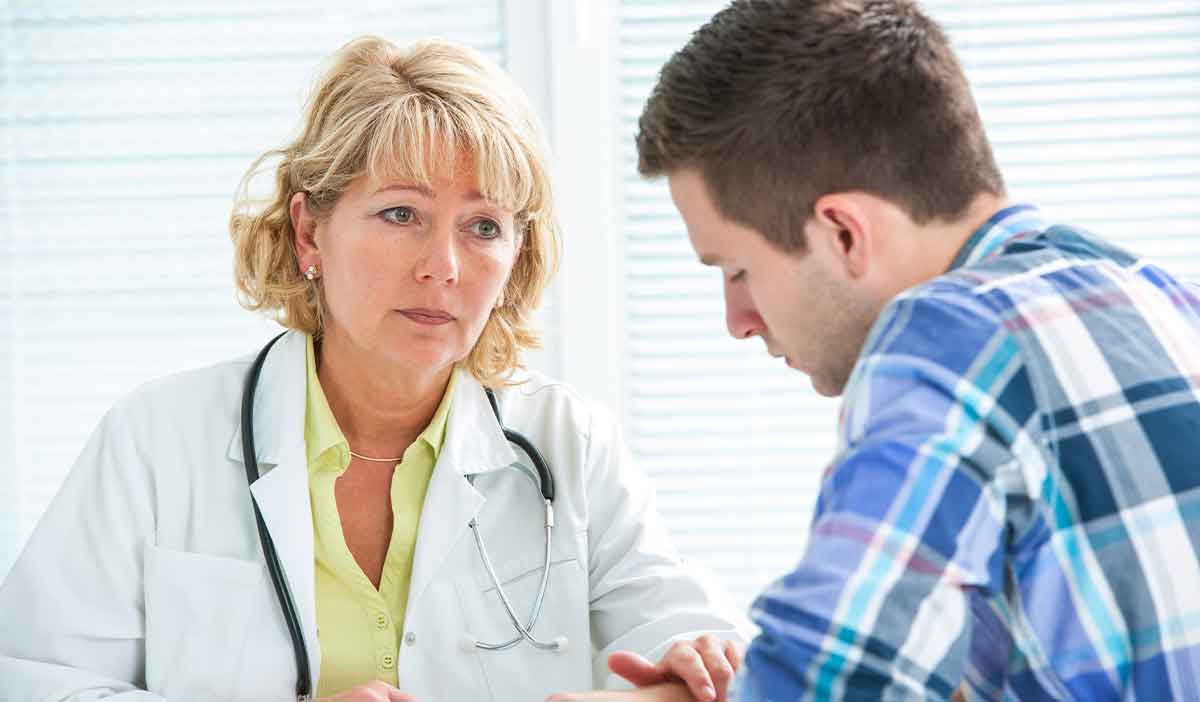 doctor assisting patient with medication treatment