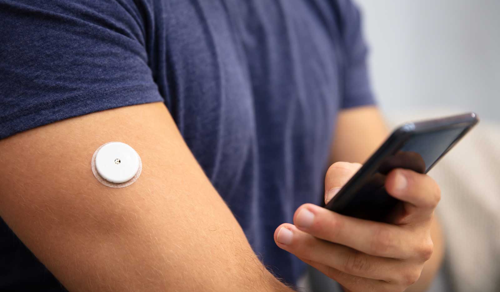 Man recently diagnosed with diabetes monitors his blood sugar
