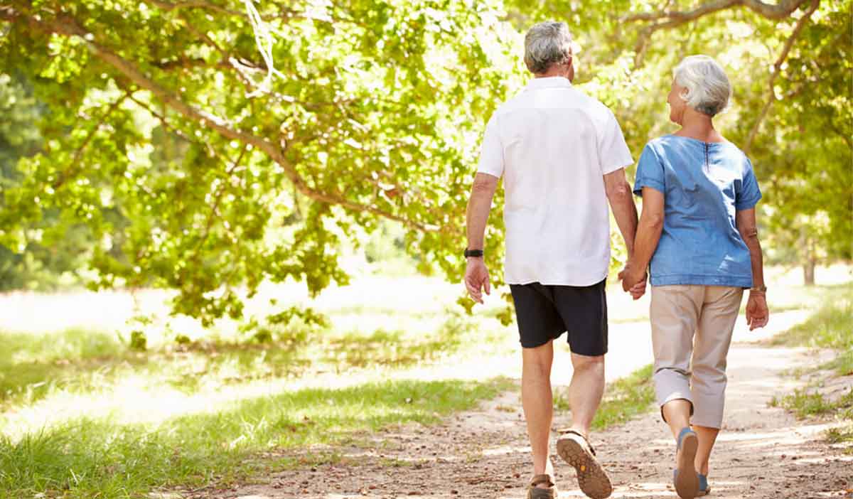 Seniors walking without pain after hip replacement surgery